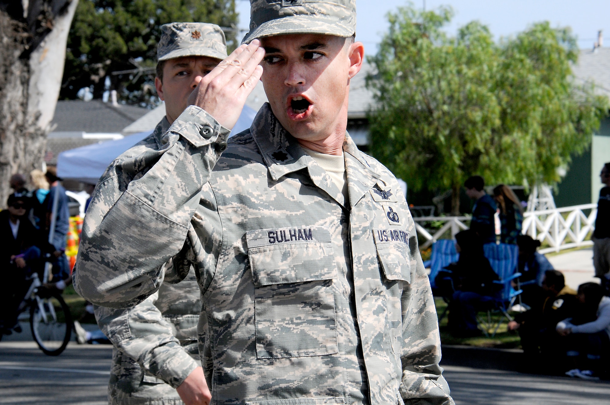 Lt. Col. Clifford Sulham, a member of the LAAFB marching unit, salutes the reviewing stand during the Torrance Armed Forces Day Celebration, May 16. (Photo by Joe Juarez) 