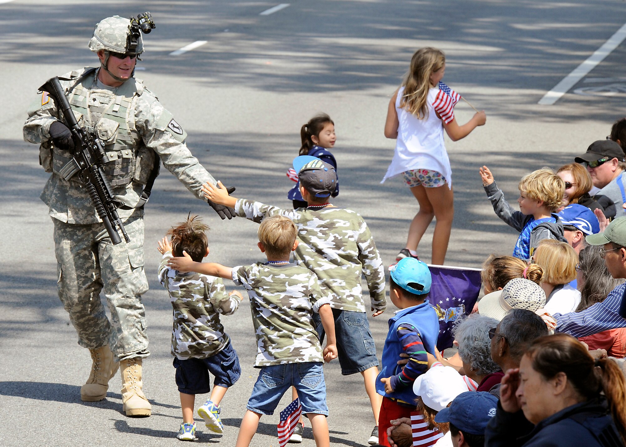 A soldier greets the crowds during the annual Torrance Armed Forces Day parade, May 16. (Photo by Joe Juarez) 