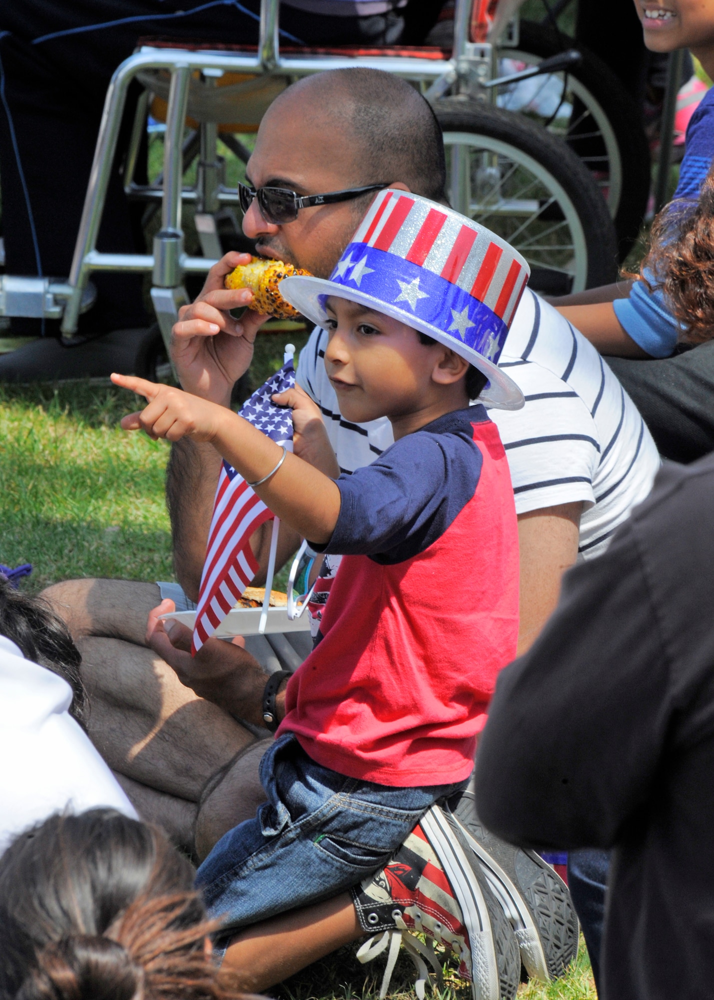 Spectators show their patriotic spirit during the annual Torrance Armed Forces Day parade, May 16. (Photo by Joe Juarez) 