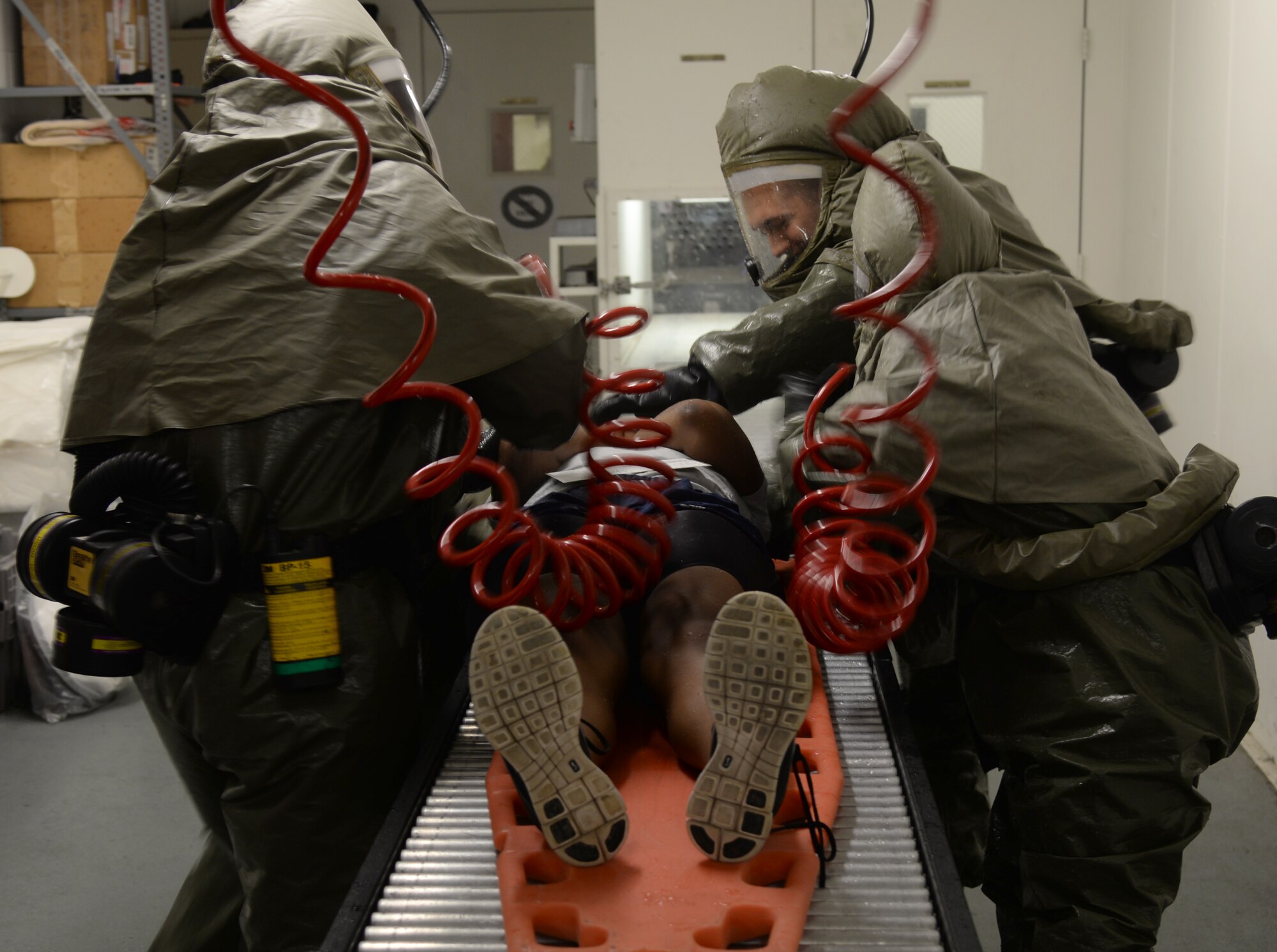 Members of the 51st Medical Group practice decontamination techniques during a simulated mass casualty exercise May 14, 2015, at Osan Air Base, Republic of Korea.  The scenario was part of the readiness exercise Beverly Midnight 15-02 and included coordination between multiple agencies across the base. (U.S. Air Force photo by Staff Sgt. Benjamin Sutton/Released) 