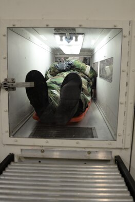 An Airman waits inside a simulated decontamination area before continuing to be processed May 14, 2015, at Osan Air Base, Republic of Korea. Members of Team Osan are participating in the combat exercise Beverly Midnight 15-02. The exercise focuses on readiness, testing Osan’s wartime procedures, and realistically looking at our ability to defend the base, execute operations and receive follow-on forces. (U.S. Air Force photo by Staff Sgt. Benjamin Sutton/Released)