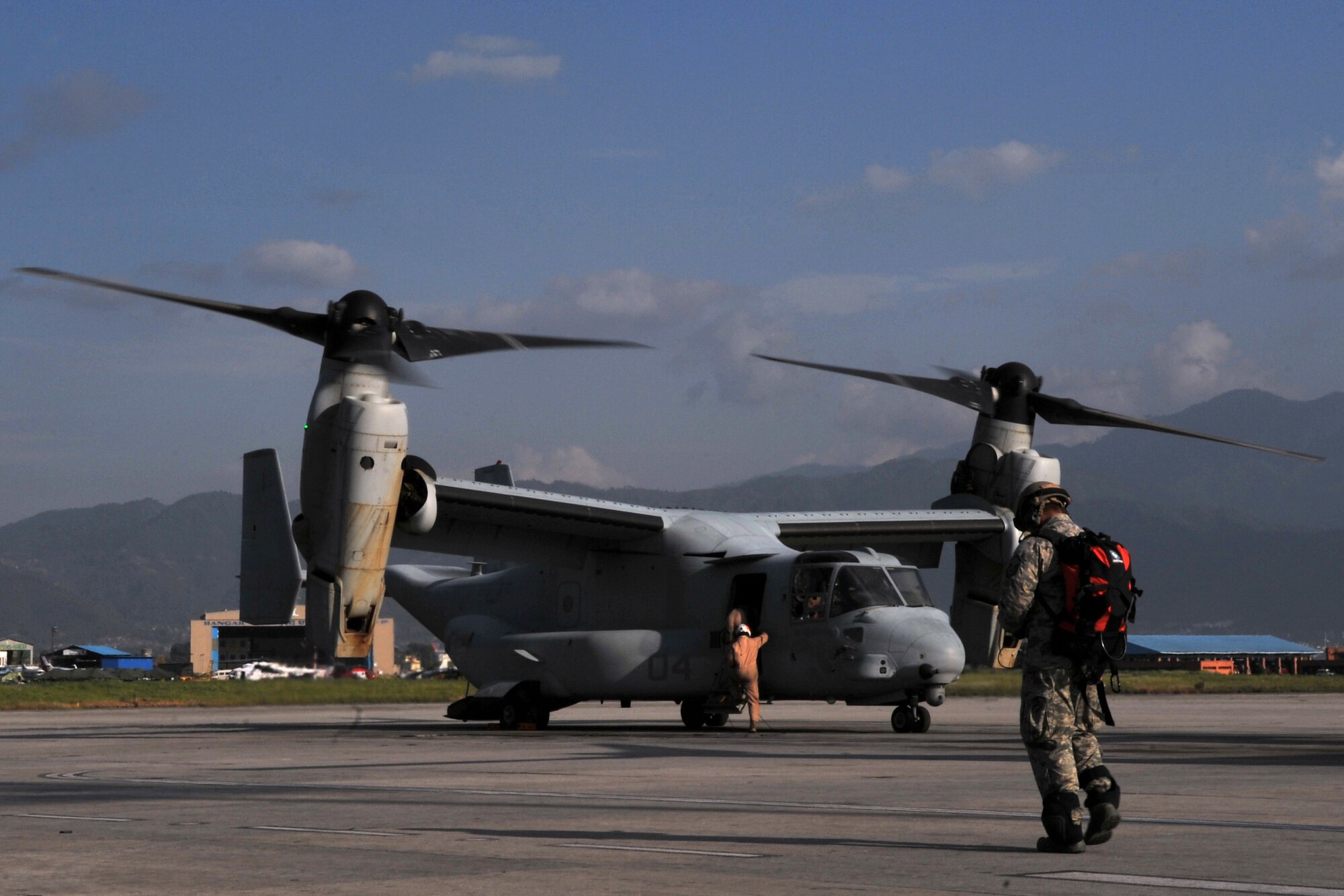 U.S. Air Force Master Sgt. Joe Damian, 36th Contingency Response Group independent duty medical technician-paramedic, walks to a U.S. Marine Corps MV-22 Osprey for a casualty evacuation mission at the Tribhuvan International Airport in Kathmandu, Nepal, May 14, 2015. Damian flew on nine sorties in three days with the Marines in support of Operation Sahayogi Haat and transported a total of six patients following the second earthquake the struck Nepal May 12, 2015. (U.S. Air Force photo by Staff Sgt. Melissa B. White/Released)