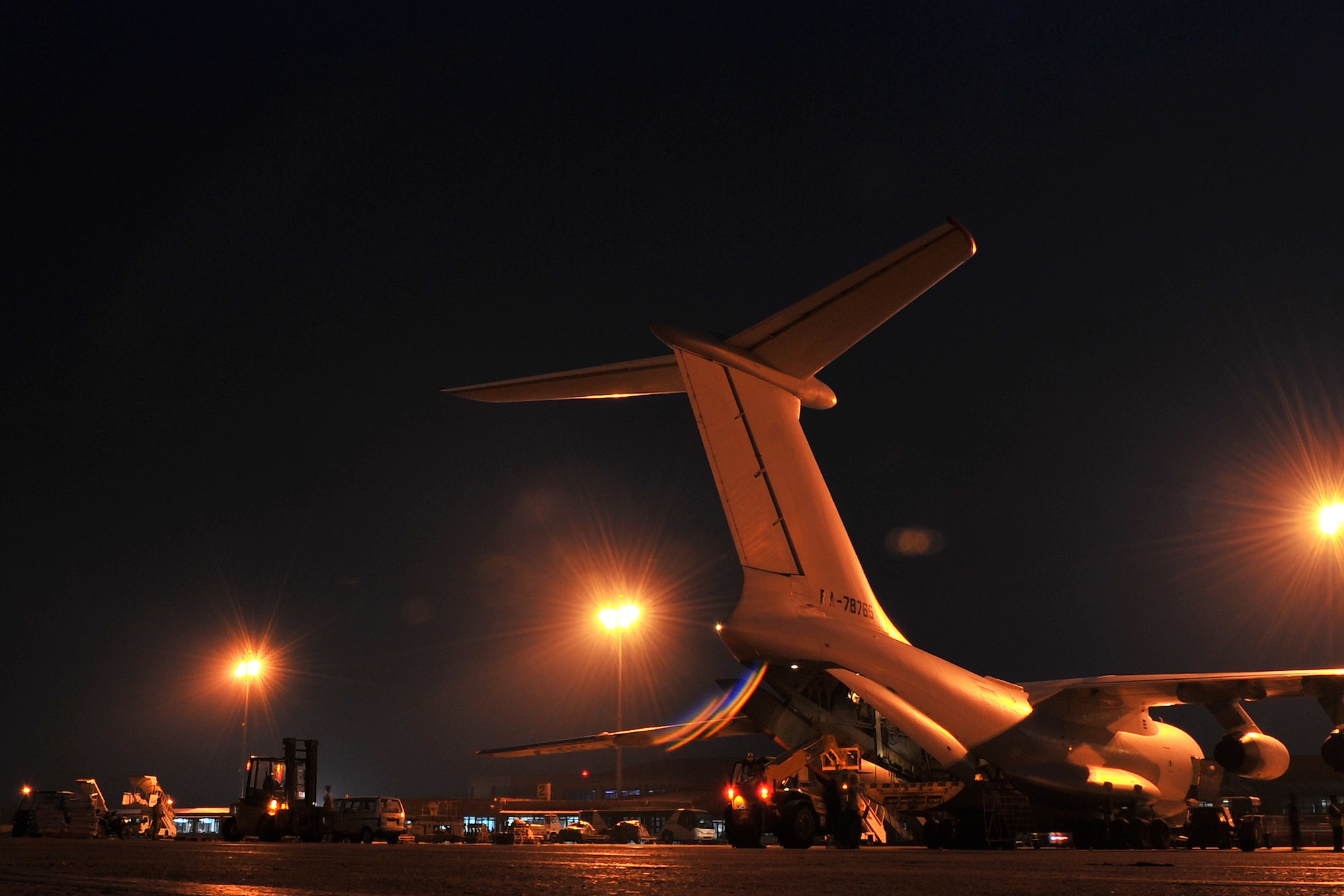 U.S. Air Force 36th Contingency Response Group Airmen unload relief supplies from an Ilyushin IL-76 cargo aircraft at the Tribhuvan International Airport in Kathmandu, Nepal, May 8, 2015. The Airmen arrived in Nepal May 5, 2015, to assist the government of Nepal and U.S. Agency for International Development to process relief supplies following a devastating earthquake and have helped process more than 4 million pounds of cargo as of May 16, 2015. (U.S. Air Force photo by Staff Sgt. Melissa B. White/Released)