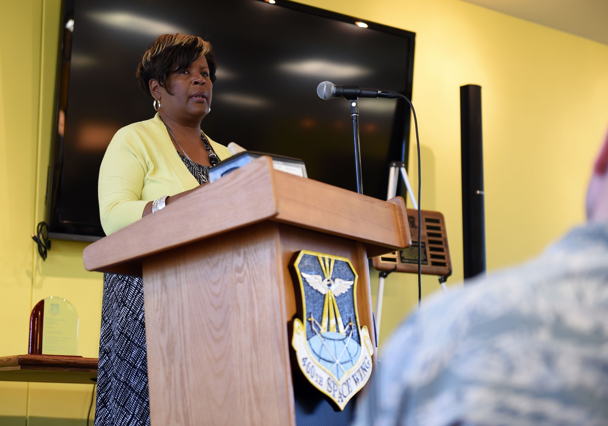 Lisa R. Buckley, American Automation Building Solutions Inc. chief of operations speaks during the Community Heroes of Buckley event May 14, 2015, at the Panther Den on Buckley Air Force Base, Colo. Every year, Buckley Air Force Base recognizes one individual from the local community for their efforts made toward supporting Team Buckley by presenting them the Community Hero of Buckley award. (U.S. Air Force Photo by Airman 1st Class Emily E. Amyotte/Released)