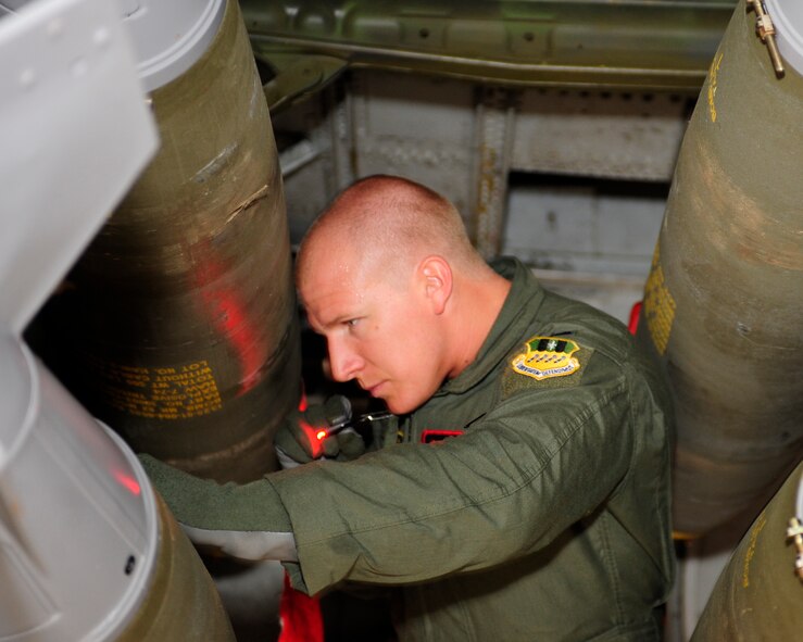 1st Lt. Joshua Stephens, a 96th Bomb Squadron weapons systems operator, inspects 500-pound Mark 82 general purpose bombs in the bomb bay of a B-52H Stratofortress at Barksdale Air Force Base, La., May 17, 2015. Two B-52s from the 2nd Bomb Wing departed the base May 17 on a 35-hour nonstop mission from home station to support U.S. Central Command's Exercise Eager Lion 2015. Exercise Eager Lion is one of USCENTCOM's premiere exercises, and consists of a series of simulated scenarios to facilitate a coordinated, partnered military response to both conventional and unconventional threats. While U.S. participation in Exercise Eager Lion occurs on a regular basis, this year marks the first time the B-52 is integrated into the exercise. (U.S. Air Force photo/Staff Sgt. Jason McCasland) 