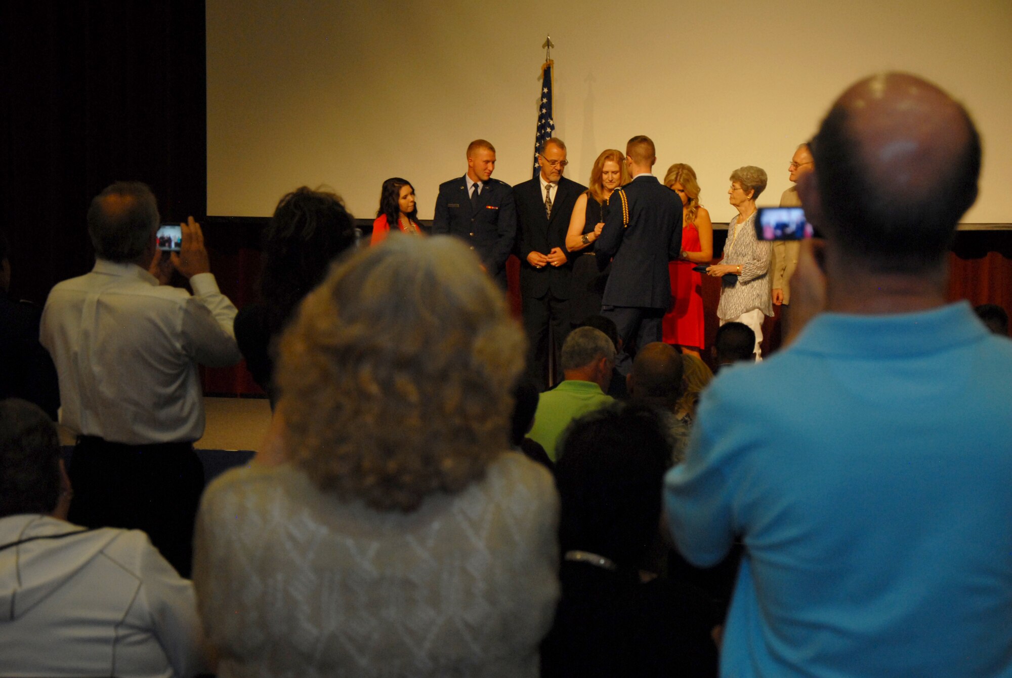 U.S. Air Force 2nd Lt. Dylan J. Meador, Air Force ROTC Detachment 847 graduate, has his family pin his second lieutenant rank onto his uniform during the Air Force ROTC Det. 847 Commissioning Ceremony at Angelo State University’s C. J. Davidson Conference Center in San Angelo, Texas, May 15, 2015. Meador commissioned with seven other ASU ROTC cadets. (U.S. Air Force photo by Senior Airman Joshua Edwards/ Released)