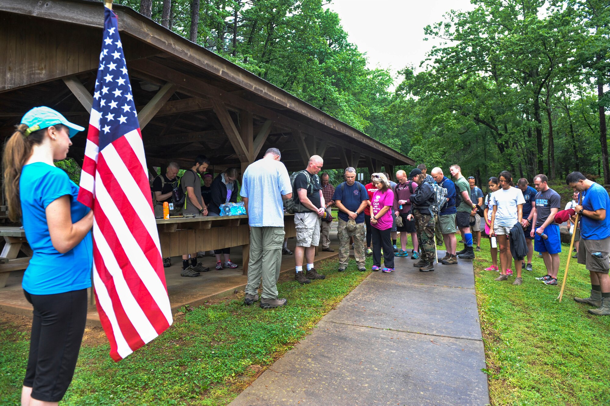 Chaplain (Lt. Col.) Herbert Hodde, 188th Wing chaplain, leads Airmen and families in a prayer at the start of the 50 Summit Challenge May 8, 2015, at Mount Magazine State Park, Ark. The 50 Summit challenge was designed for Airmen to proudly display the Air Force flag from the highest points in each of our 50 states as well have fun, expand personal boundaries and get outdoors. (U.S. Air Force photo by Senior Airman Stephanie Serrano)