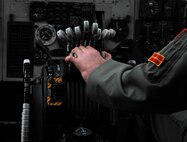 Capt. Kristin Nelson, 23rd Bomb Squadron pilot, prepares to take flight on Minot Air Force Base, N.D., April 30, 2015. It was Nelson’s first flight back since an accident that amputated her left hand. However, doctors were able to successfully re-attach it. (U.S. Air Force photo/Senior Airman Kristoffer Kaubisch)