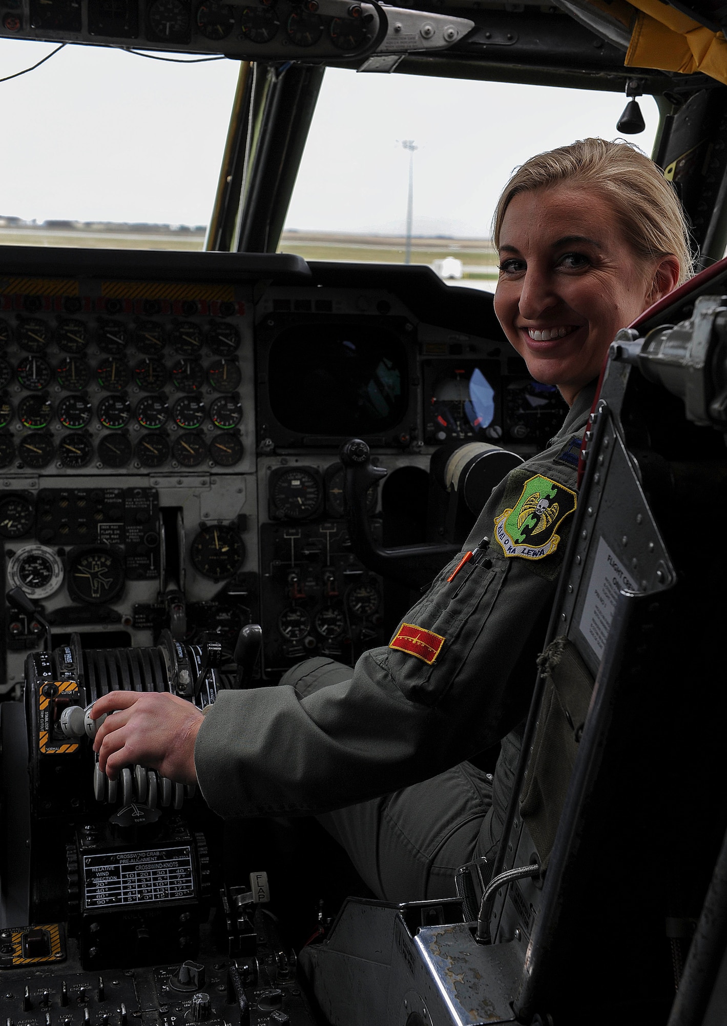 Capt. Kristin Nelson, 23rd Bomb Squadron pilot, prepares to take flight on Minot Air Force Base, N.D., April 30, 2015. It was Nelson’s first flight back since an accident that amputated her left hand. However, doctors were able to successfully re-attach it. (U.S. Air Force photo/Senior Airman Kristoffer Kaubisch)
