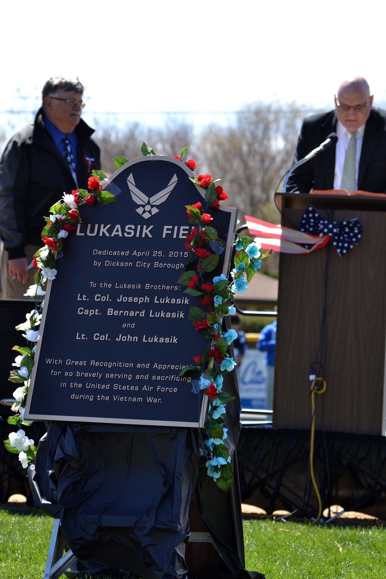 A dedication ceremony for the ball field April 25, 2015 at Dickson City, Pa.’s Crystal Park, pays honor to three Air Force aviator brothers from the town. The plaque bearing their names will be mounted appropriately on the flag pole beyond the center field fence. (U.S. Air National Guard photo by Master Sgt. Christopher Botzum/Released)