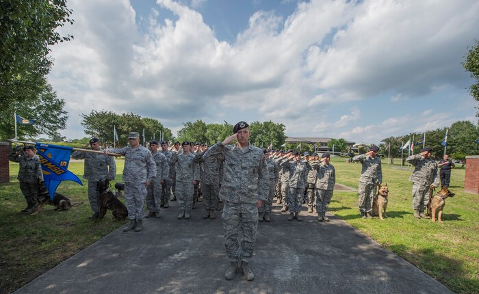 Defenders from the 628th Security Forces Squadron salute May 15, 2015 at Joint Base Charleston, S.C., during a police week retreat ceremony. The week is celebrated nationally to remember those who have been killed in the line of duty. (U.S. Air Force photo/Senior Airman Jared Trimarchi)