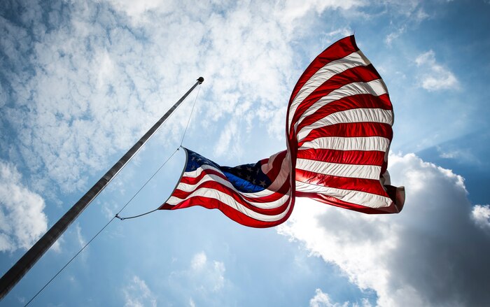 The U.S. flag flies at half-staff May 15, 2015 at Joint Base Charleston, S.C., during a police week retreat ceremony to honor servicemembers who made the ultimate sacrifice.  The week is celebrated nationally to remember those who have been killed in the line of duty. (U.S. Air Force photo/Senior Airman Jared Trimarchi)