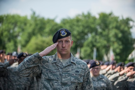 Capt. Jon Blount, 628th Security Forces Squadron, salutes the flag May 15, 2015 at Joint Base Charleston, S.C., during a police week retreat ceremony. The week is celebrated nationally to remember those who have been killed in the line of duty. (U.S. Air Force photo/Senior Airman Jared Trimarchi)