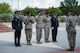 A flag detail consisting of members from the 17th Security Forces Squadron and the San Angelo Police Department ask permission to retire the American Flag during the National Police Week Retreat Ceremony in front of the Norma Brown Building on Goodfellow Air Force Base, Texas, May 15, 2015. The 17th SFS and SAPD came together and held a retreat ceremony to commemorate Peace Officers Memorial Day and National Police Week. (U.S. Air Force photo by Senior Airman Michael Smith/Released)