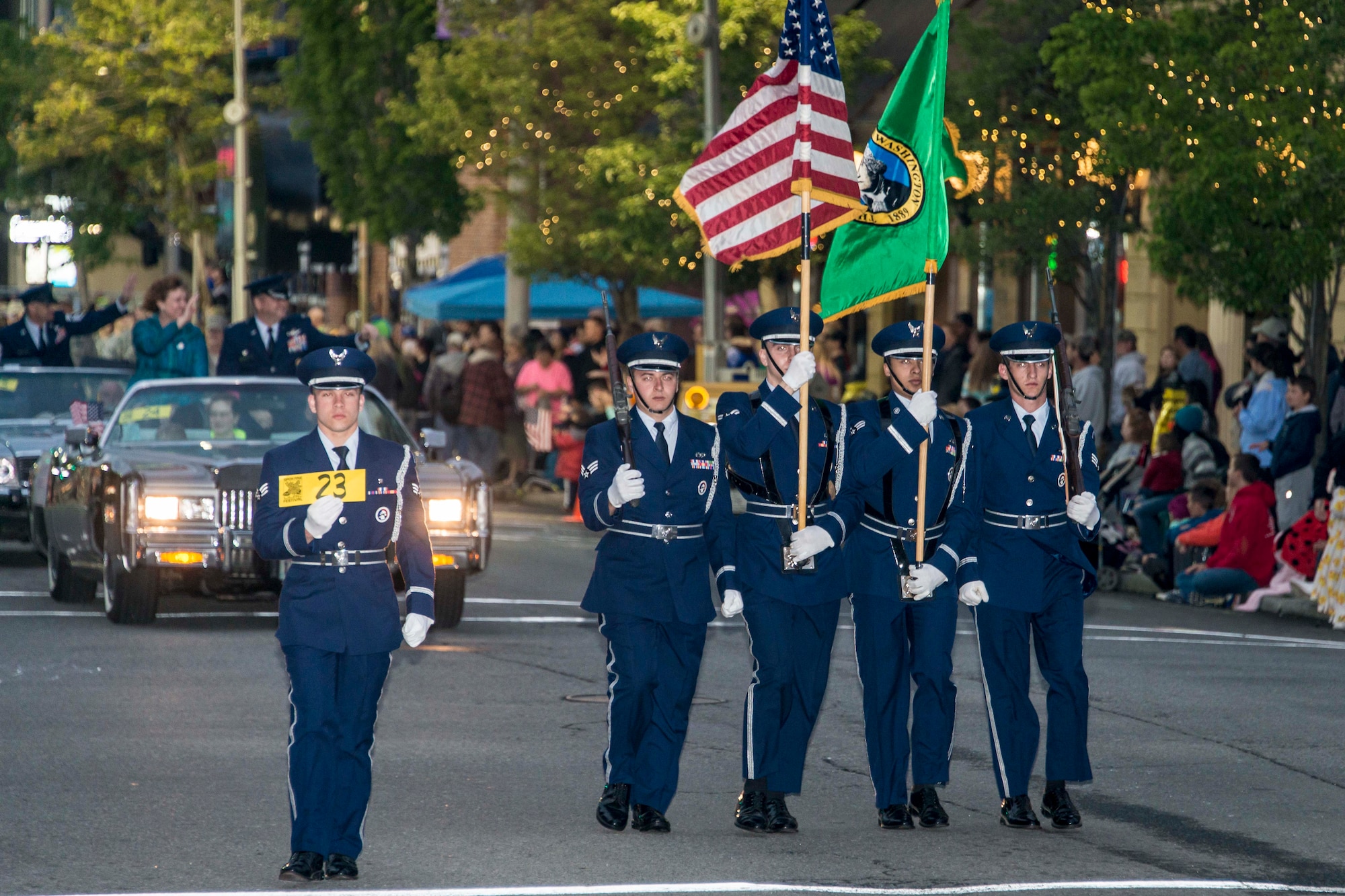 Fairchild’s color guard marches in the 77th Annual Spokane Lilac Festival Armed Forces Torchlight Parade May 16, 2015, in downtown Spokane, Wash. This parade is the largest of its kind in the country featuring military units, veterans, marching bands, community floats, and equestrian and specialty units. (U.S. Air Force photo/Staff Sgt. Benjamin W. Stratton)