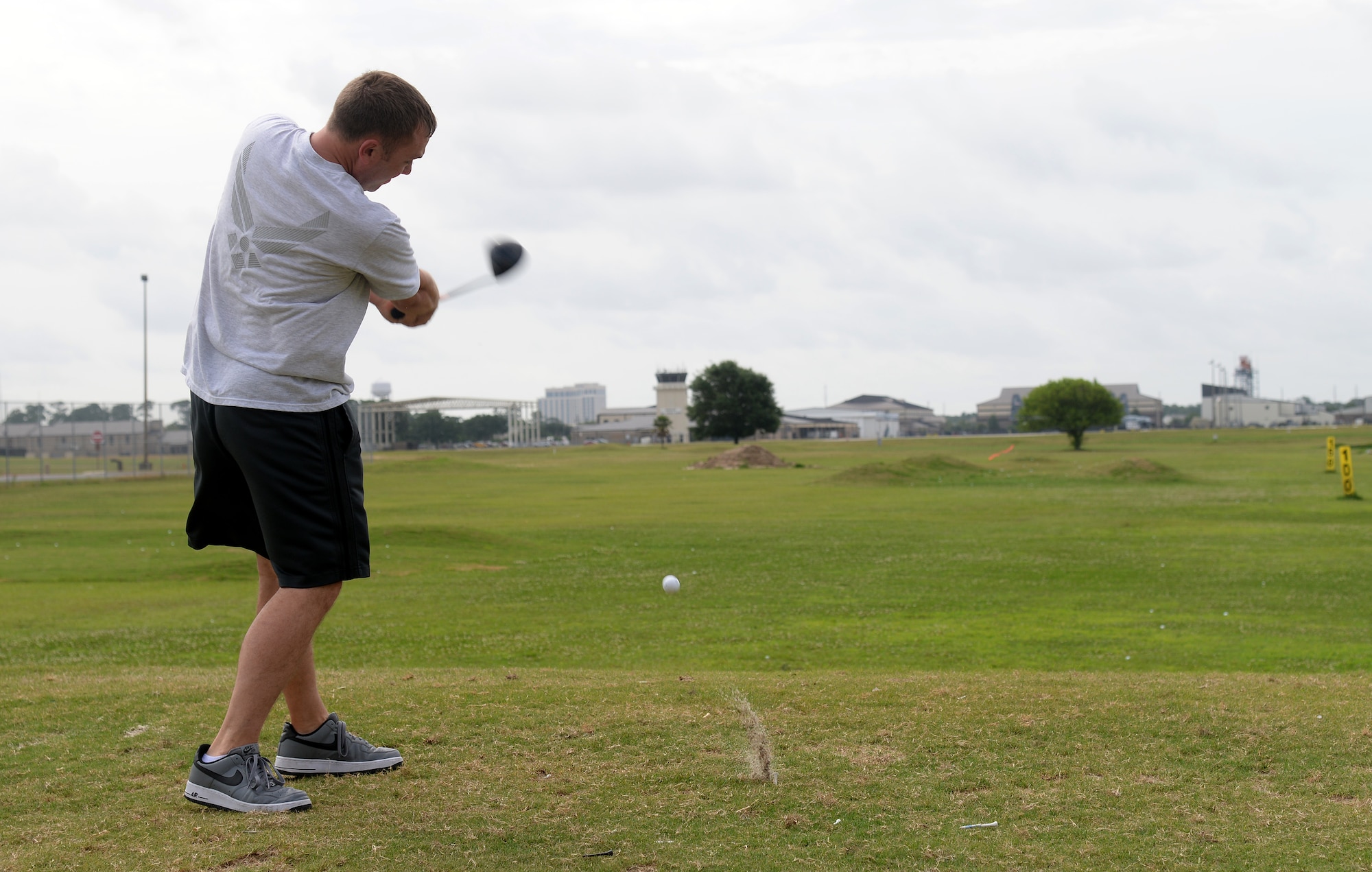 Maj. Jayson Cabell, 81st Comptroller Squadron commander, competes in the longest drive golf competition at Keesler Sports Day, May 15, 2015, Keesler Air Force Base, Miss. Members of Team Keesler participated in different sports throughout the day including, sand volleyball and the last man standing push-up challenge to celebrate National Fitness and Sports Month. (U.S. Air Force photo by Senior Airman Holly Mansfield)