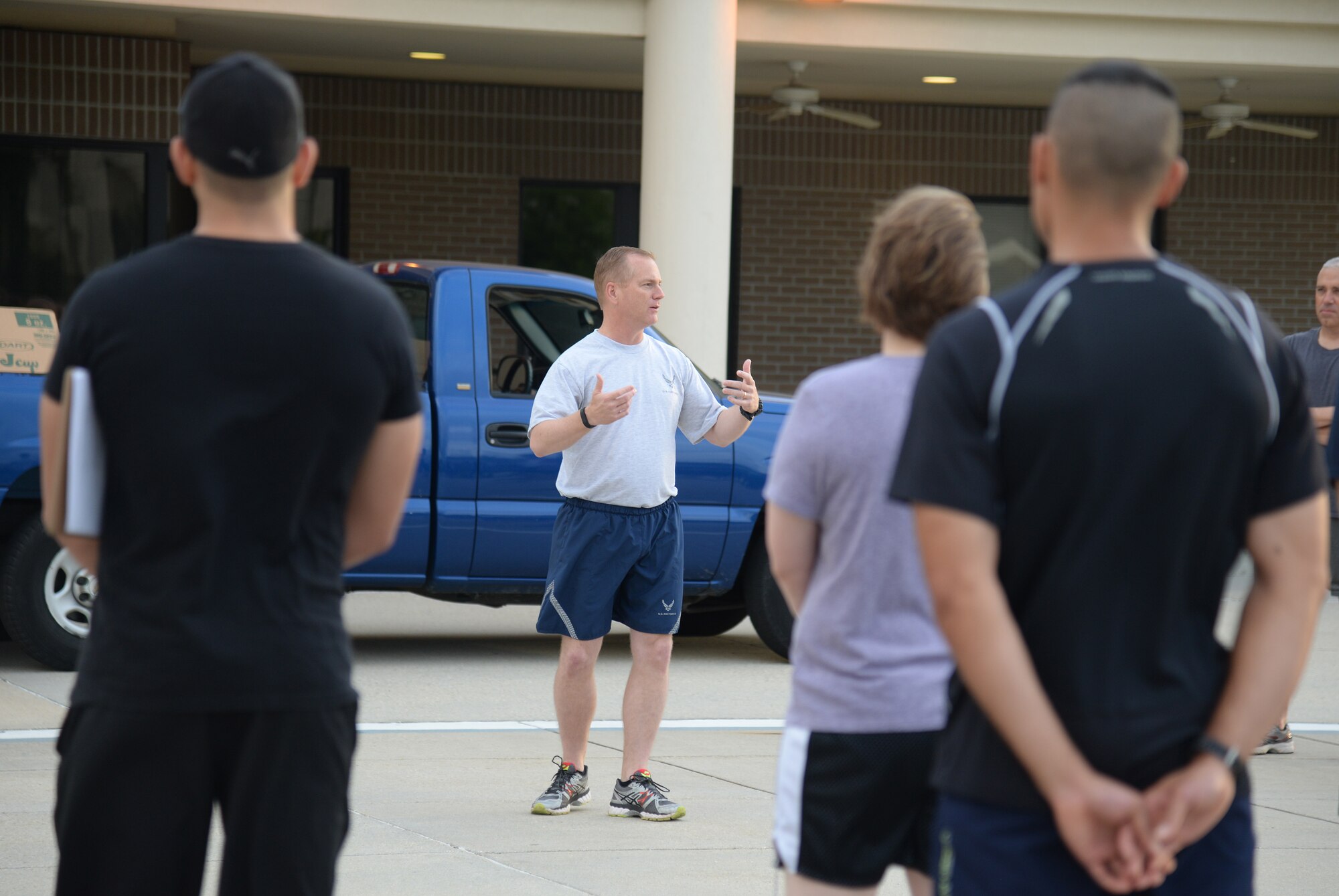 Col. Dennis Scarborough, 81st Training Wing vice commander, speaks to Keesler Sports Day participants at the opening ceremony, May 15, 2015, Keesler Air Force Base, Miss. Members of Team Keesler participated in different sports throughout the day including, sand volleyball and the last man standing push-up challenge to celebrate National Fitness and Sports Month. (U.S. Air Force photo by Senior Airman Holly Mansfield)