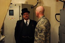 President Teddy Roosevelt, portrayed by Joe Wiegand, learns about the 91st Missile Wing mission at the Uniform-01 Training Facility on Minot Air Force Base, N.D., May 7, 2015. Wiegand visited Minot AFB to perform at the Military Affairs Committee luncheon and the Elementary schools. (U.S. Air Force photo/Senior Airman Kristoffer Kaubisch)