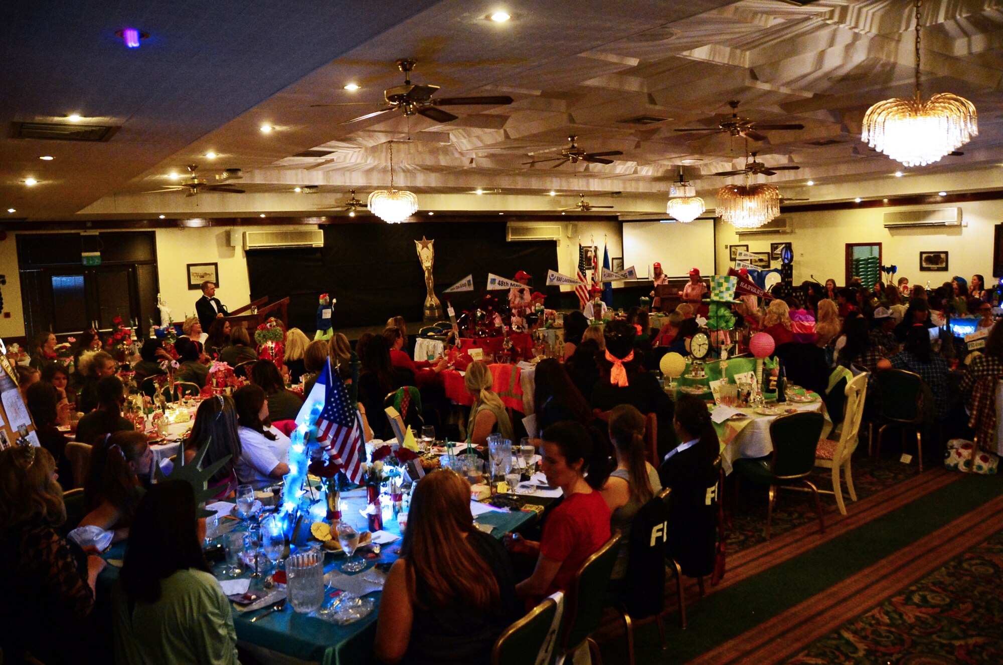 48th Fighter Wing spouses attend the first-ever Liberty Spouses Dining-In at Royal Air Force Lakenheath, England, May 8, 2015. The movie-themed event gave spouses from around the wing the opportunity to interact with other participants both in their unit and across the greater spouse community. (U.S. Air Force photo by Senior Airman Erin O’Shea/Released)