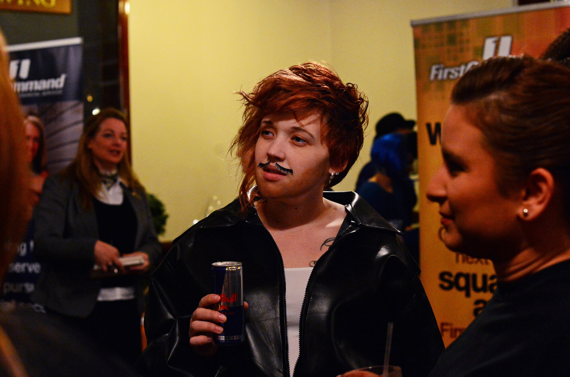 Participants mingle during social hour at the movie-themed Liberty Spouses Dining-In at Royal Air Force Lakenheath, England, May 8, 2015. More than 160 Liberty Wing spouses participated in the event which consisited of Liberty Oscar competitions in spirt, table decorating, costumes and skits. (U.S. Air Force photo by Senior Airman Erin O’Shea/Released) 