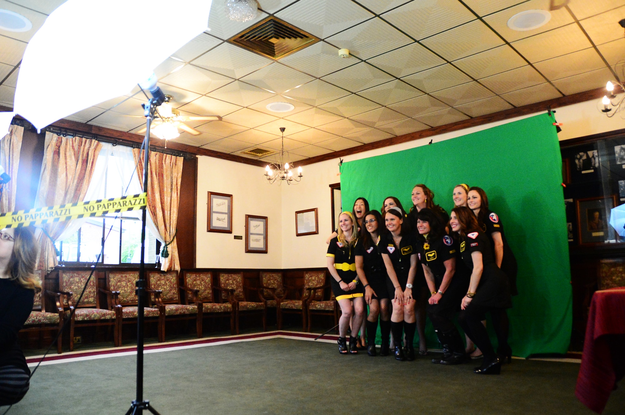 Spouses from the 493rd Fighter Squadron pose for a photo during the Liberty Spouses Dining-In at Royal Air Force Lakenheath, May 8, 2015. More than 160 Liberty Wing spouses participated in the event which consisited Liberty Oscar competitions in spirit, skits, table decorations and costumes. (U.S. Air Force photo by Senior Airman Erin O’Shea/Released)