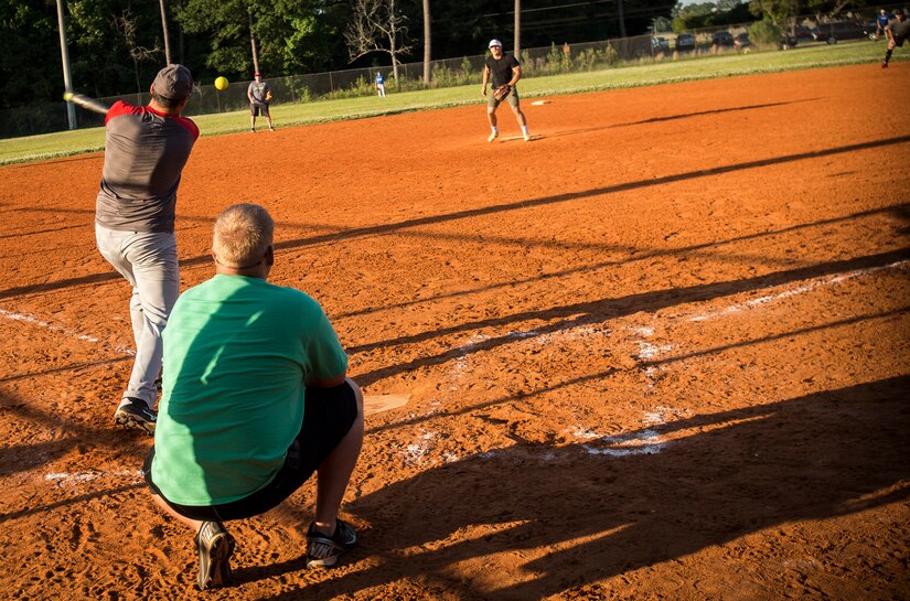 A batter from the Flyers team delivers a hit during the softball game, May 13, 2015 at Joint Base Charleston – Air Base, S.C. Joint Base Charleston’s 2015 Intramural Softball Season is expected to run till mid-June. (U.S. Air Force photo/Airman 1st Class Clayton Cupit)
