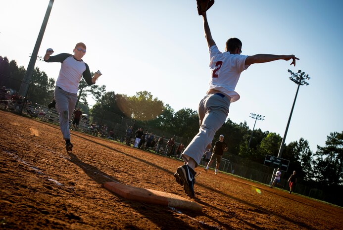Brad Nicholson, 628th Comptroller Squadron/Wing Staff Agencies, stretches for a ball thrown to first base during a softball game, May 13, 2015 at Joint Base Charleston – Air Base, S.C. 628th CPTS/WSA beat the FLYERS 6-3. The season is expected to run until mid-June. (U.S. Air Force photo/Airman 1st Class Clayton Cupit)