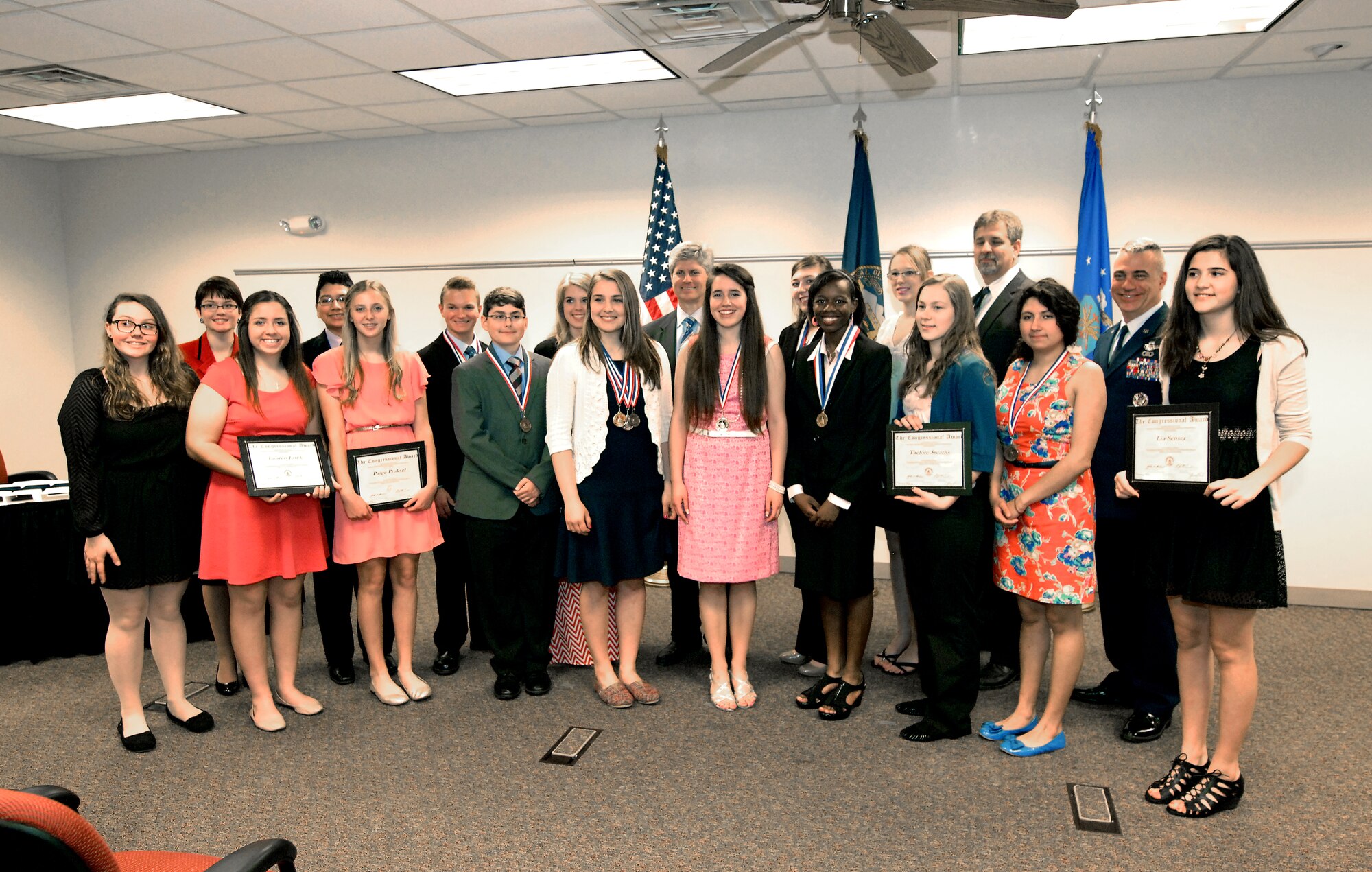 High school students from across Sarpy County, Nebraska pose for a group picture after being awarded medals or certificates by Congressman Jeff Fortenberry as part of the Congressional Award Program held May 8 at the Bellevue Public Schools Welcome Center in Bellevue, Nebraska. The program recognizes youth, ages 14 through 23, who achieve personal goals in public service, personal development, physical fitness and completion of an expedition or exploration. The annual awards program is administered by the 55th Force Support Squadron and Bellevue Public Schools. (U.S. Air Force photo by Delanie Stafford / Released)