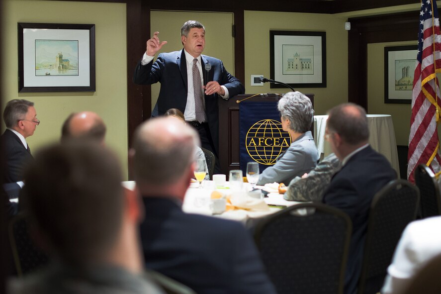 Dr. William A. LaPlante, assistant secretary of the Air Force for acquisition, addresses industry and government employees during a Lexington-Concord Chapter of the Armed Forces Communications and Electronics Association-sponsored event in Lexington, Mass., May 13. The speech came during a visit to nearby Hanscom AFB, Mass., which also included stops at MITRE and MIT’s Lincoln Laboratory, where he attended the Air Vehicle Survivability Workshop. (U.S. Air Force photo by Mark Herlihy)
