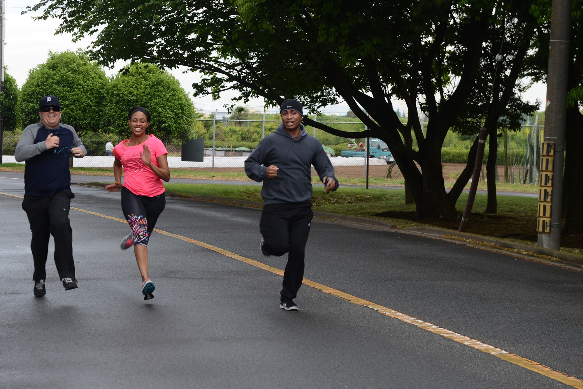 Members of the 374th Security Forces Squadron approach the finish line during the Police Week 5K run at Yokota Air Base, Japan, May 12, 2015. Other events included a memorial ceremony and retreat, a physical fitness challenge, displays in front of the Yokota Community Center and the Policeman's Ball. (U.S. Air Force photo by Airman 1st Class David C. Danford/Released)