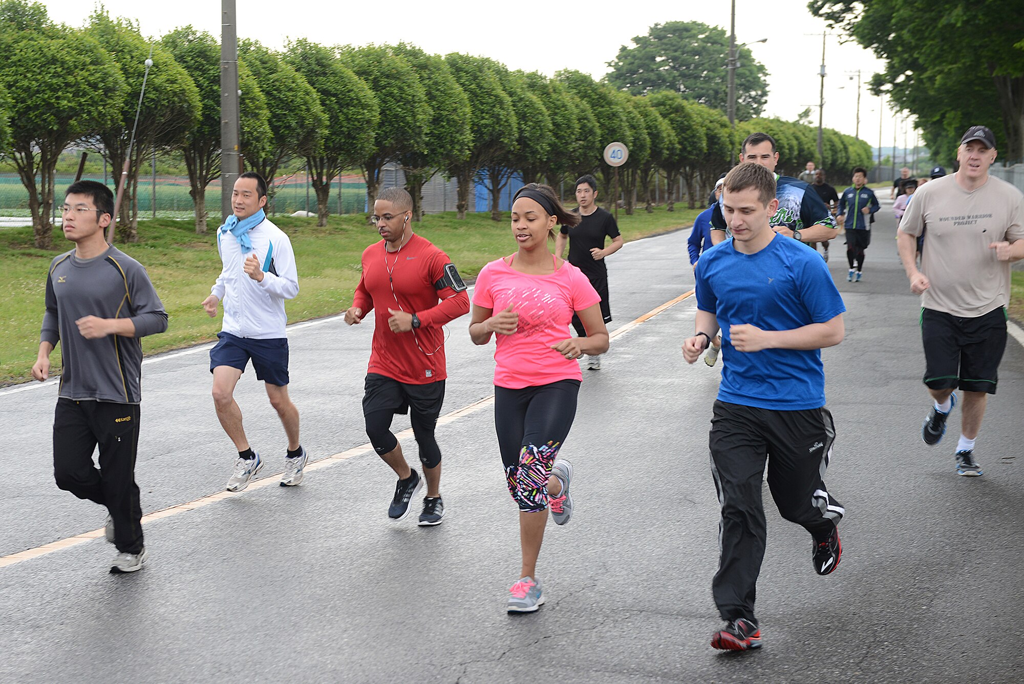 Team Yokota members participate in the Police Week 5K at Yokota Air Base, Japan, May 12, 2015. Other events included a memorial ceremony and retreat, a physical fitness challenge, displays in front of the Yokota Community Center and a Policeman's Ball. (U.S. Air Force photo by Airman 1st Class David C. Danford/Released)