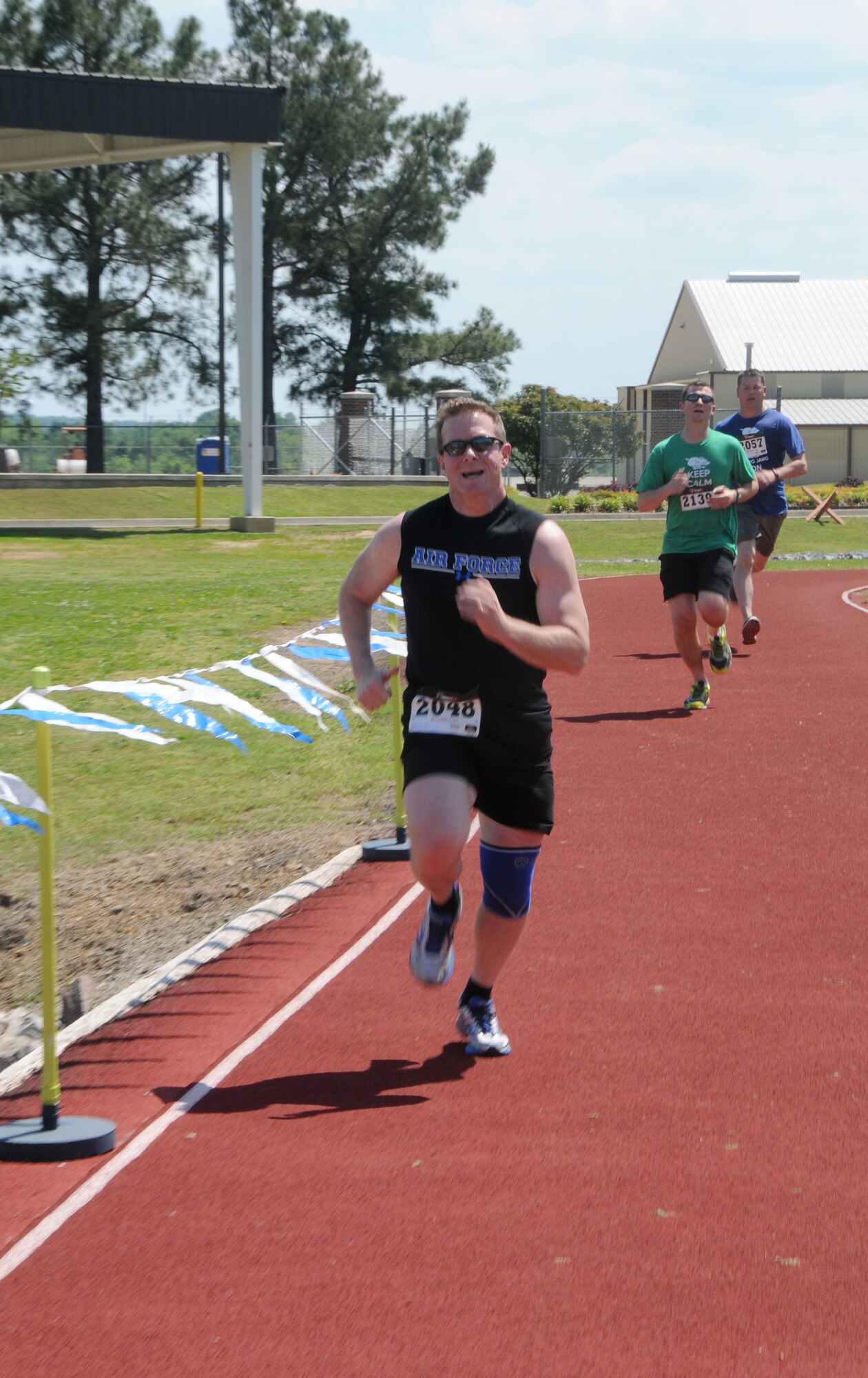Lt. Col. Herb Hodde, 188th Wing chaplain, races towards the finish during the 3rd annual Hawg Jawg 5K held May 2, 2015 at Ebbing Air National Guard Base, Fort Smith Ark. Col. Bobbi Doorenbos, 188th Wing commander, presented medals to all the top athletes in their respective age categories.  (U.S. Air National Guard photo by Senior Airman Cody Martin/released)