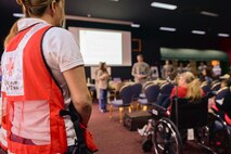 Dependents and military members assigned to Osan Air Base, Korea, listen to briefings from various services on Yokota Air Base, Japan, May 15, 2015. The dependents and military members went through the entire noncombatant evacuation process as part of a readiness inspection. (Airman 1st Class Elizabeth Baker/Released)