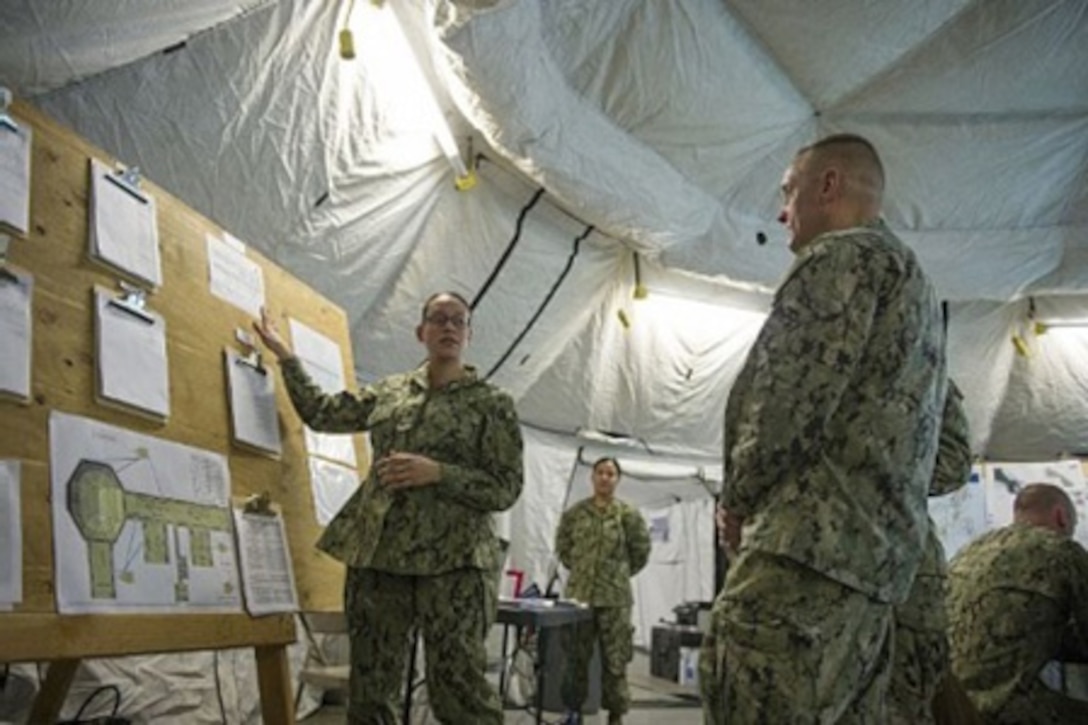 This year’s Nuclear Weapon Accident Incident Exercise, or NUWAIX 2015, took place on Naval Base Kitsap-Bangor, located on the Kitsap Peninsula in the state of Washington. The Defense Department whole-of-government exercise was held May 5-8, 2015, and involved home-grown terrorists and a nuclear incident. Here, assessors evaluate elements of the exercise after its completion May 8. Defense Threat Reduction Agency photo