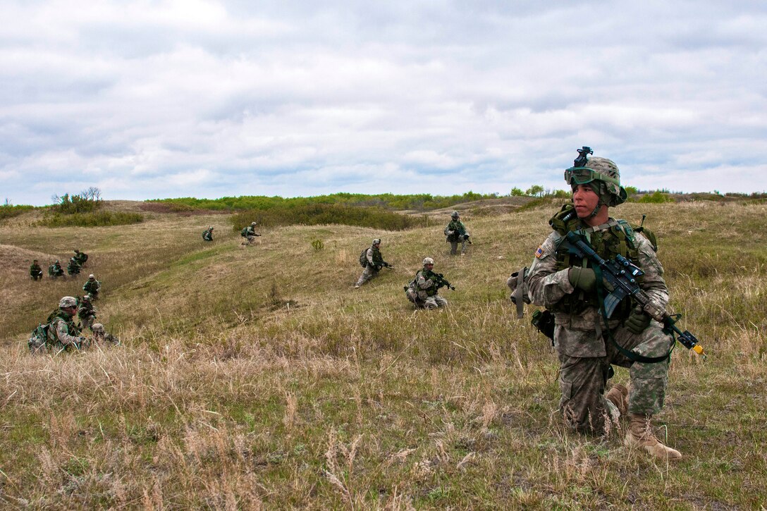 A U.S. soldier scans for opposing forces on a patrol during air assault ...