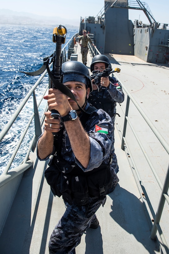 Jordanian military personnel and U.S. Coast Guardsmen assigned to Maritime Security Response Team, Direct Action Section 2, practice visit, board, search and seizure procedures aboard Logistics Support Vessel USAV SP4 James A. Loux during exercise Eager Lion 2015 in the Gulf of Aqaba, Jordan, May 16, 2015. 