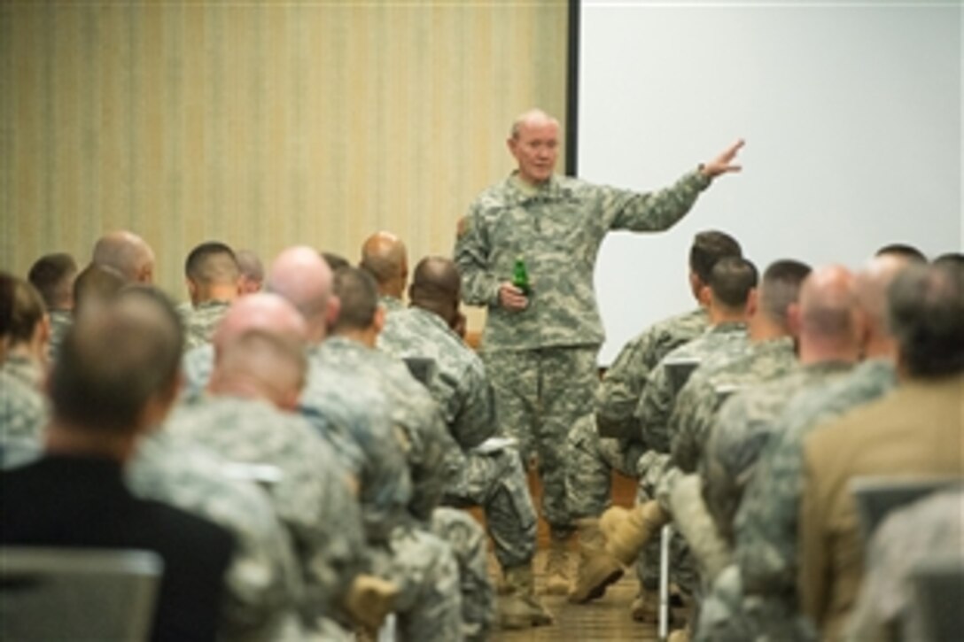 Army Gen. Martin E. Dempsey, chairman of the Joint Chiefs of Staff, talks with senior leaders of the 1st Infantry Division at the base conference center during a visit to Fort Riley, Kan., May 14, 2015. 