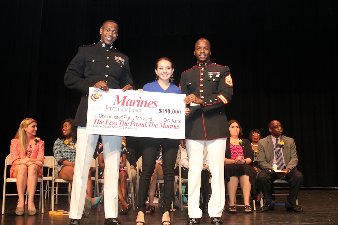 (From left to Right)  Capt. Ronnie D. Jones, Raven Chapman and Staff Sgt.
Elijah E. Davis pose for a photo after awarding a Naval Reserve Officer
Training Corps check at Battery Creek High School, Beaufort, S.C., May 13,
2015.  Chapman was selected to receive $180,000 scholarship among 45
applicants from Recruiting Station Jacksonville, Fla.  
