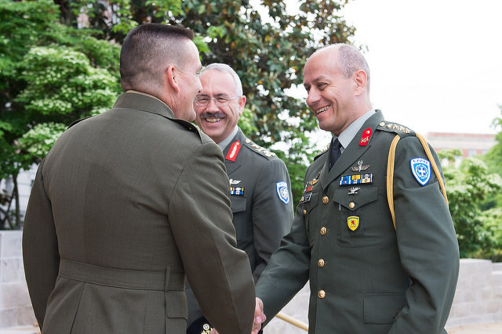 NDU President Major General Fred Padilla (l), welcomes LTG Dimitrios Thomaidis (center), Commandant of Greece's Hellenic National Defense College, and Greek Colonel Evangelos Papadopoulos (r) to NDU.