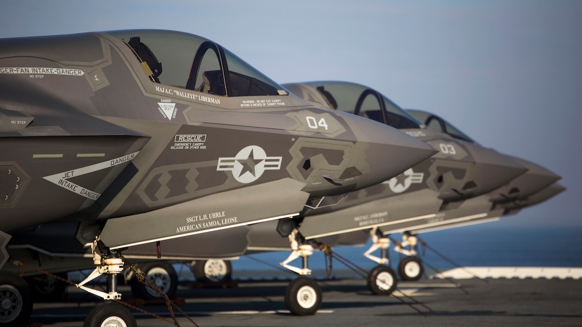Four F-35B Lighting II Joing Strike Fighters sit secured to the deck after their arrival aboard the Uss Wasp (LHD-1), May 18, 2015. As the future of Marine Corps aviation, the F-35B will eventually replace all aircraft from three legacy Marine Corps platforms; th AV-8B Harrier, the F/A-18 Hornet, and the EA-6B Prowler. The aircraft are stationed with Marine Fighter Attack Training Squadron 501, Marine Aircraft Group 31, 2nd Marine Aircraft Wing, Beaufort, South Carolina and Marine Fighter Attack Squadron 121, Marine Aircraft Group 13, 3rd Marine Aircraft Wing, Yuma, Arizona. (U.S. Marine Corps photo by Lance Cpl. Remington Hall/Released)