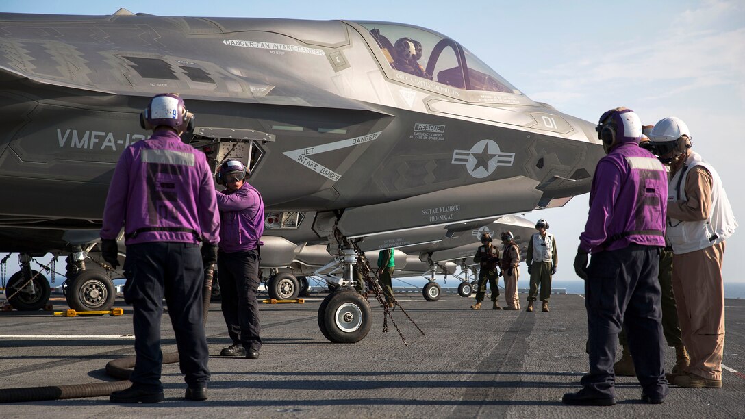 Marines and sailors aboard the Uss Wasp (LHD-1) secure and refuel an F-35B Lightning II Joint Strike Fighter after its arrival for the first session of operational testing, May 18, 2015. Data and information gathered from OT-1 will lay the groundwork for F-35B deployments aboard Navy amphibious ships and the announcement of the Marine Corps' initial operating capacity of the F-35B in July. The aircraft are stationed with Marine Fighter Attack Training Squadron 501, Marine Aircraft Group 31, 2nd Marine Aircraft Wing, Beaufort, South Carolina and Marine Fighter Attack Squadron 121, Marine Aircraft Group 13, 3rd Marine Aircraft Wing, Yuma, Arizona. (U.S. Marine Corps photo by Lance Cpl. Remington Hall/Released)