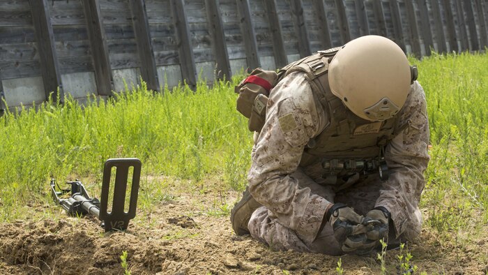 Staff Sgt. Philip Mayer, an explosive ordnance technician with 2nd Explosive Ordnance Company, 8th Engineer Support Battalion clears remnants of an improvised explosive device during a demolition exercise aboard Marine Corps Base Camp Lejeune, North Carolina, May 14, 2015. The exercise is part of the unit’s preparations for an upcoming deployment with Special Purpose Marine Air-Ground Task Force Crisis Response-Africa and gave Marines hands-on training with tools that allow them to neutralize hazards while causing minimal damage in urban settings. 