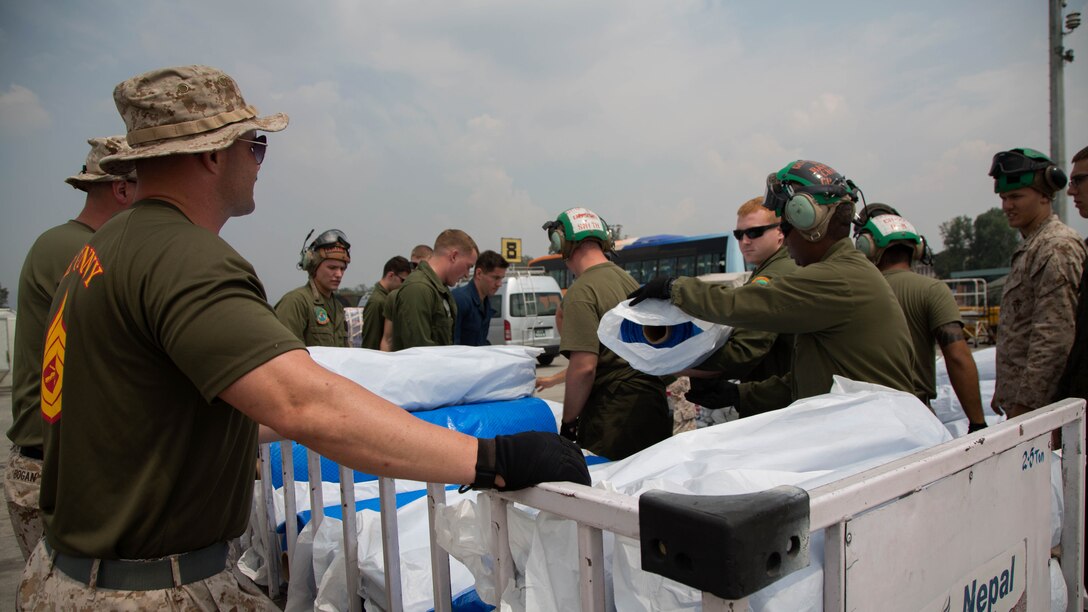 U.S. Service members from Joint Task Force 505 prepare to load relief supplies from Samaritan’s Purse International Relief Organization onto a U.S. Marine Corps MV-22 Osprey at Tribhuvan International Airport, Kathmandu, Nepal, May 16. JTF 505 along with other multinational forces and humanitarian relief organizations are currently in Nepal providing aid after a 7.8 magnitude earthquake struck the country, April 25 and a 7.3 earthquake on May 12. At Nepal’s request the U.S. government ordered JTF 505 to provide unique capabilities to assist Nepal. 