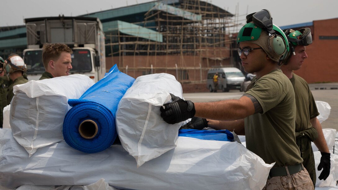 U.S. Service members from Joint Task Force 505 prepare to load relief supplies from Samaritan’s Purse International Relief Organization onto a U.S. Marine Corps MV-22 Osprey at Tribhuvan International Airport, Kathmandu, Nepal, May 16. JTF 505 along with other multinational forces and humanitarian relief organizations are currently in Nepal providing aid after a 7.8 magnitude earthquake struck the country, April 25 and a 7.3 earthquake on May 12. At Nepal’s request, the U.S. government ordered JTF 505 to provide unique capabilities to assist Nepal. 