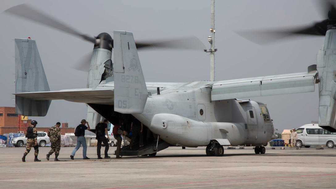 Members from Samaritan’s Purse International Relief Organization and Nepalese service members board an U.S. Marine Corps MV-22 Osprey assigned to Joint Task Force 505 at Tribhuvan International Airport, Kathmandu, Nepal, May 16. JTF 505 along with other multinational forces and humanitarian relief organizations are currently in Nepal providing aid after a 7.8 magnitude earthquake struck the country, April 25 and a 7.3 earthquake on May 12. At Nepal’s request the U.S. government ordered JTF 505 to provide unique capabilities to assist Nepal. 