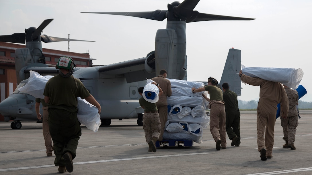 U.S. Service members from Joint Task Force 505 load relief supplies from Samaritan’s Purse International Relief Organization onto a U.S. Marine Corps MV-22 Osprey at Tribhuvan International Airport, Kathmandu, Nepal, May 16. JTF 505 along with other multinational forces and humanitarian relief organizations are currently in Nepal providing aid after a 7.8 magnitude earthquake struck the country, April 25 and a 7.3 earthquake on May 12. At Nepal’s request the U.S. government ordered JTF 505 to provide unique capabilities to assist Nepal. 