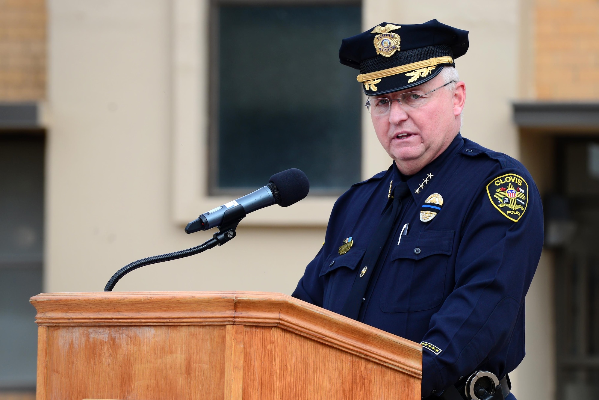 Steve Sanders, Clovis Police Department Chief of Police, delivers remarks May 14, 2015 at Cannon Air Force Base, N.M. Sanders spoke about the bond that all law enforcement shares through their dedication to safety and community. (U.S. Air Force Photo/Airman 1st Class Shelby Kay-Fantozzi)
