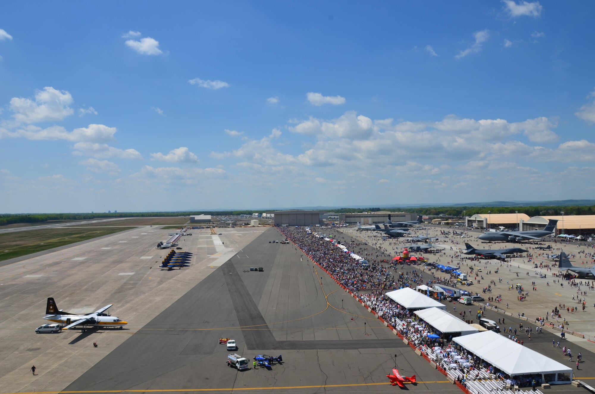 Nearly 400,000 spectators came to Westover Air Reserve Base to watch the 2015 Great New England Air Show, boasting more than two dozen current and vintage military aircraft. Aerial demonstration teams included the U.S. Navy Blue Angels, Canadian Snowbirds, U.S. Army’s Golden Knights parachuting team, F-22 demo team, Geico Skytypers, and Canadian CF-18 team. (U.S. Air Force photo/SSgt. Kelly Goonan)