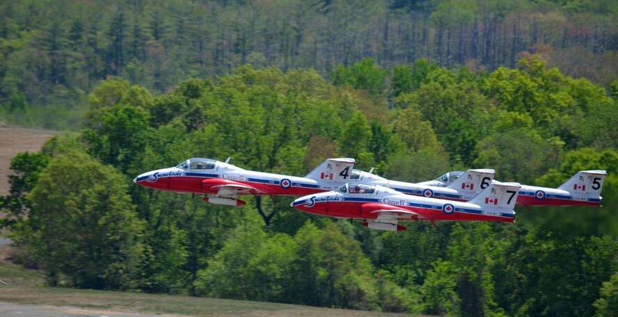 Nearly 400,000 spectators came to Westover Air Reserve Base to watch the 2015 Great New England Air Show, boasting more than two dozen current and vintage military aircraft. Aerial demonstration teams included the U.S. Navy Blue Angels, Canadian Snowbirds, U.S. Army’s Golden Knights parachuting team, F-22 demo team, Geico Skytypers, and Canadian CF-18 team. (U.S. Air Force photo/SSgt. Kelly Goonan)