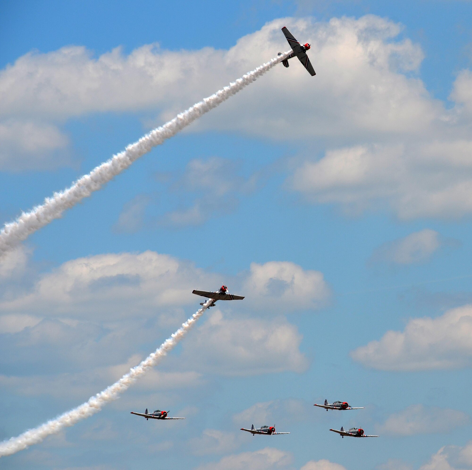 Nearly 400,000 spectators came to Westover Air Reserve Base to watch the 2015 Great New England Air Show, boasting more than two dozen current and vintage military aircraft. Aerial demonstration teams included the U.S. Navy Blue Angels, Canadian Snowbirds, U.S. Army’s Golden Knights parachuting team, F-22 demo team, Geico Skytypers, and Canadian CF-18 team. (U.S. Air Force photo/SSgt. Kelly Goonan)